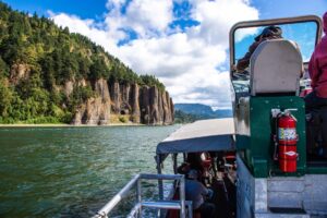 Jetboat approaching Cape Horn rock formation in gorge