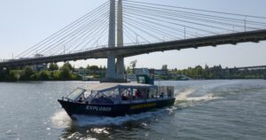 jet boat going under Tilikum Bridge