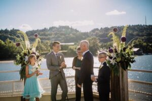Ceremony on top deck with flowers