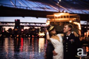 Wedding couple laughing in front of the Portland Spirit