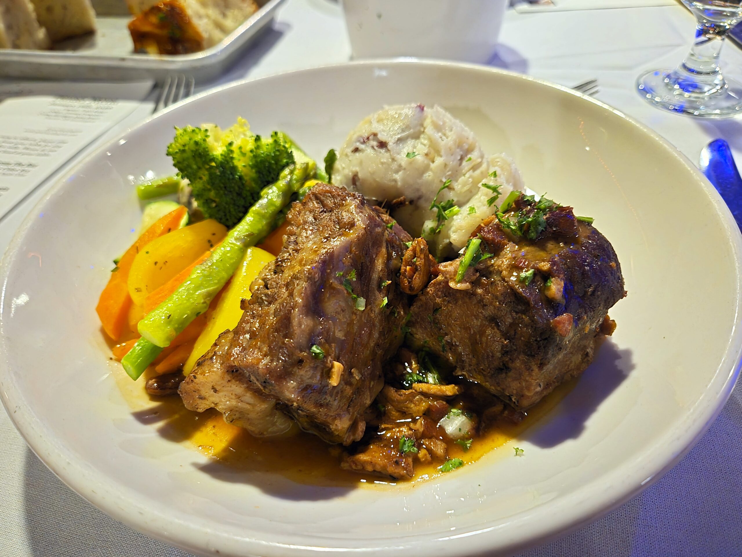 Two large boneless ribs with veggies and mashed potatoes